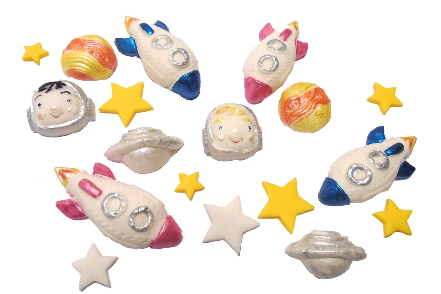 A selection of different travel-themed cake toppers. There are a selection of planets, rockets and stars.