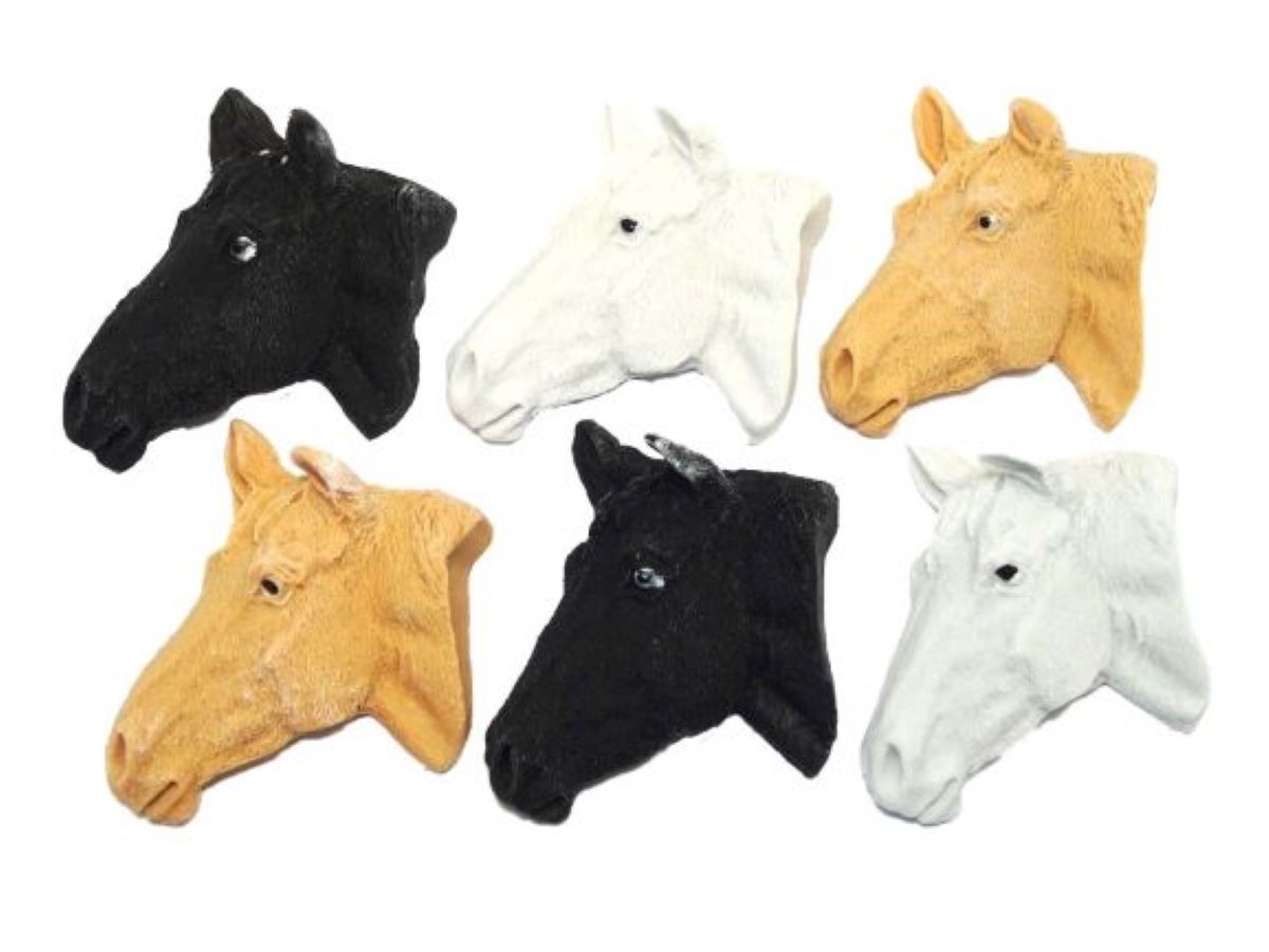 A collection of horse head cake toppers