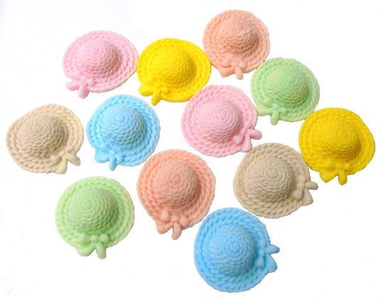 Colorful Easter cupcakes on a table with handmade bonnet decorations.