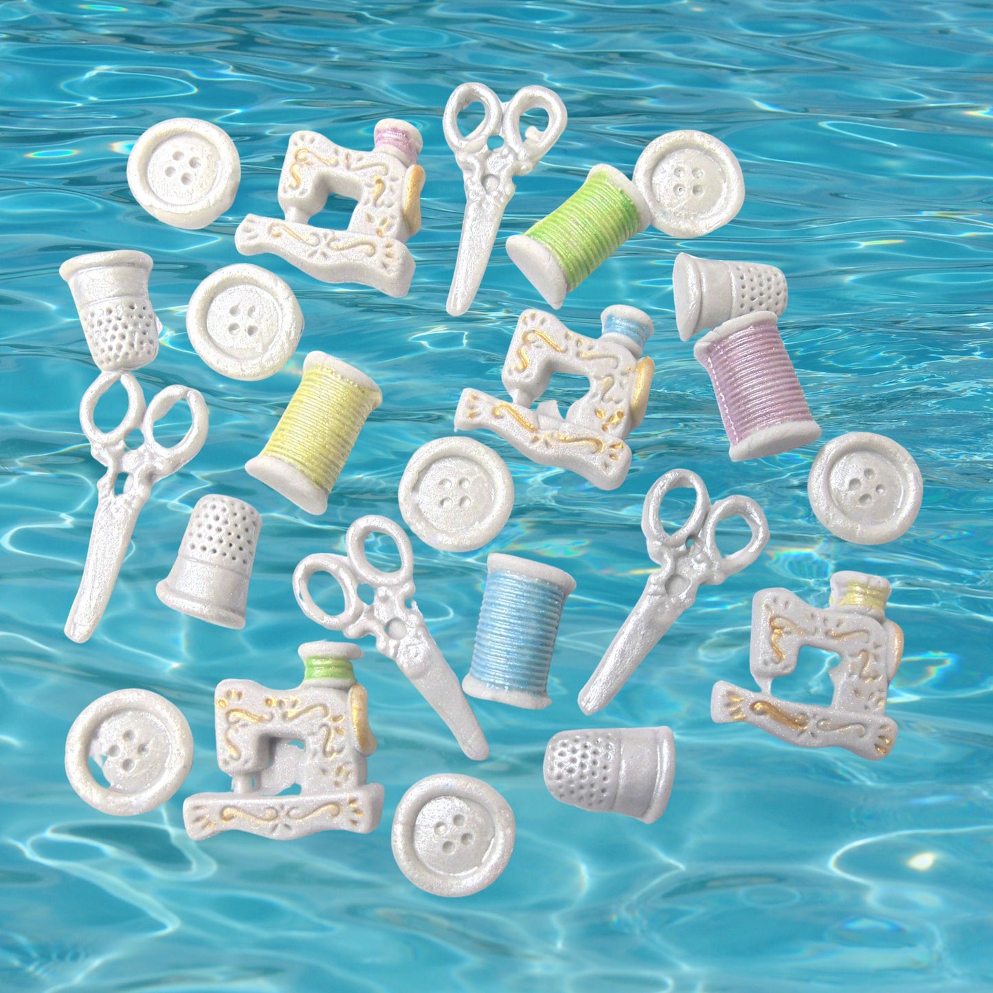 Set 24 handmade vegan sewing kit cupcake topper cake decorations on a blue background