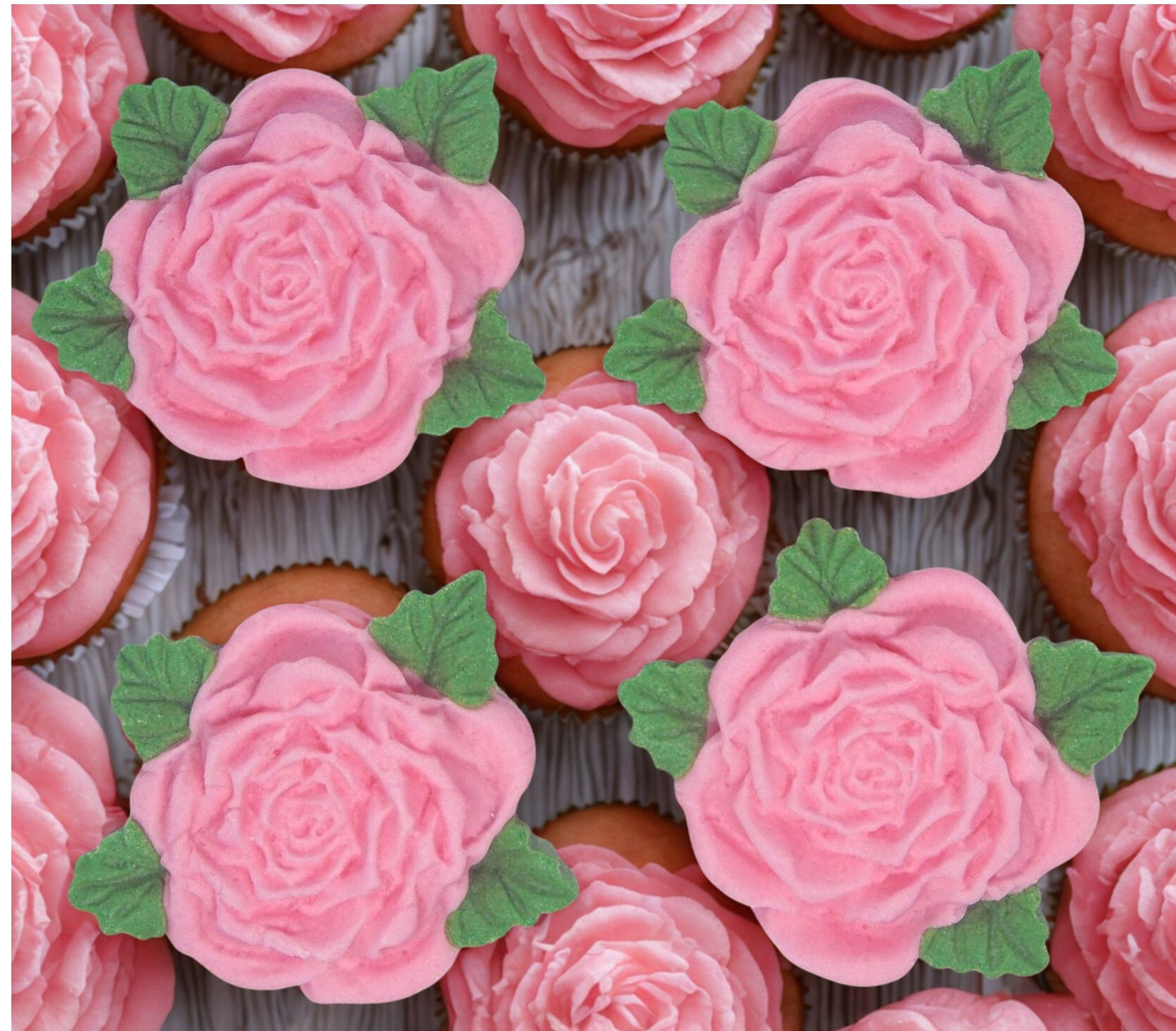 Cupcakes decorated with vegan pink rose with green leaf edible toppers