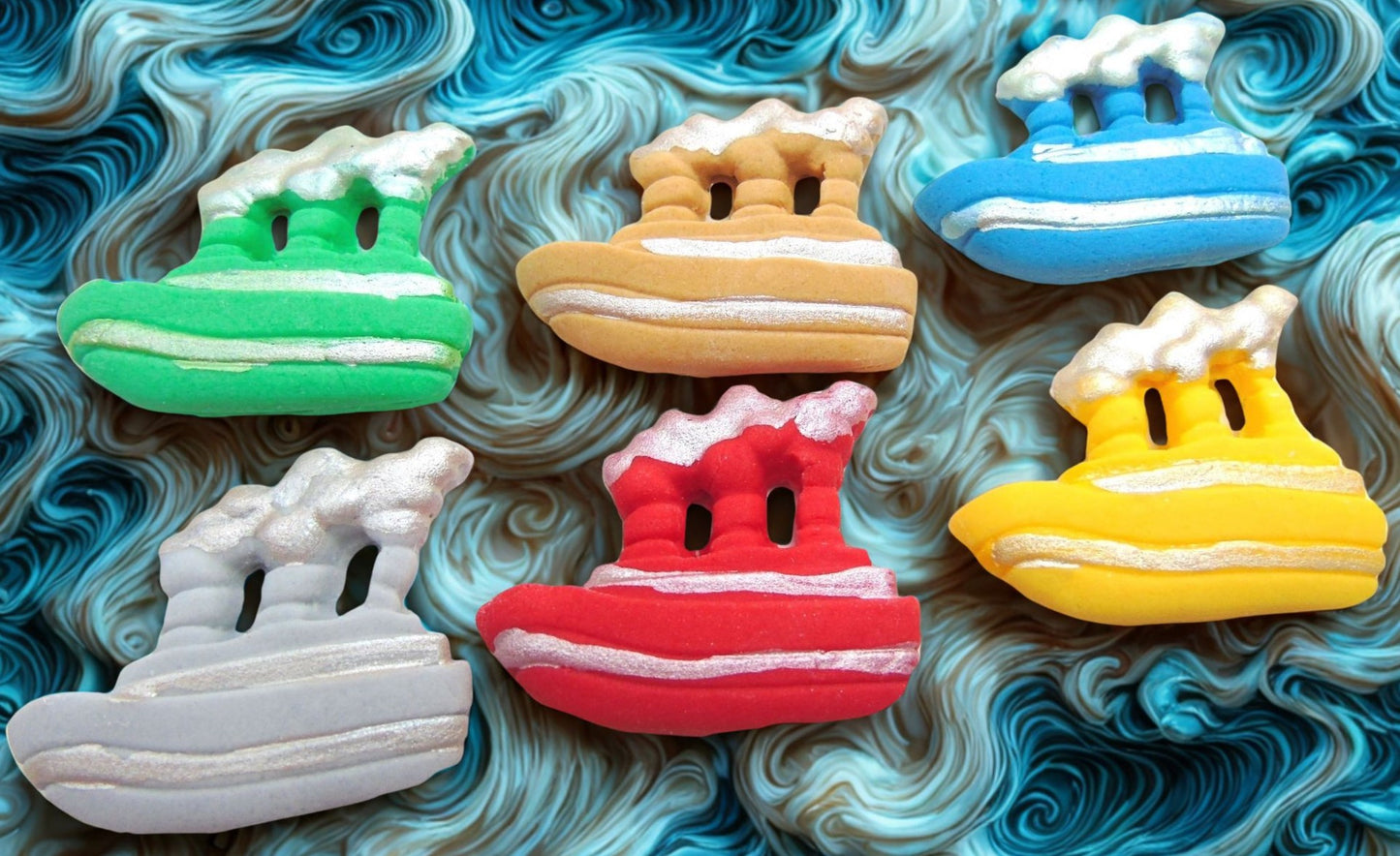 12 Novelty edible boats cupcake and cake topper decorations on a blue wave background