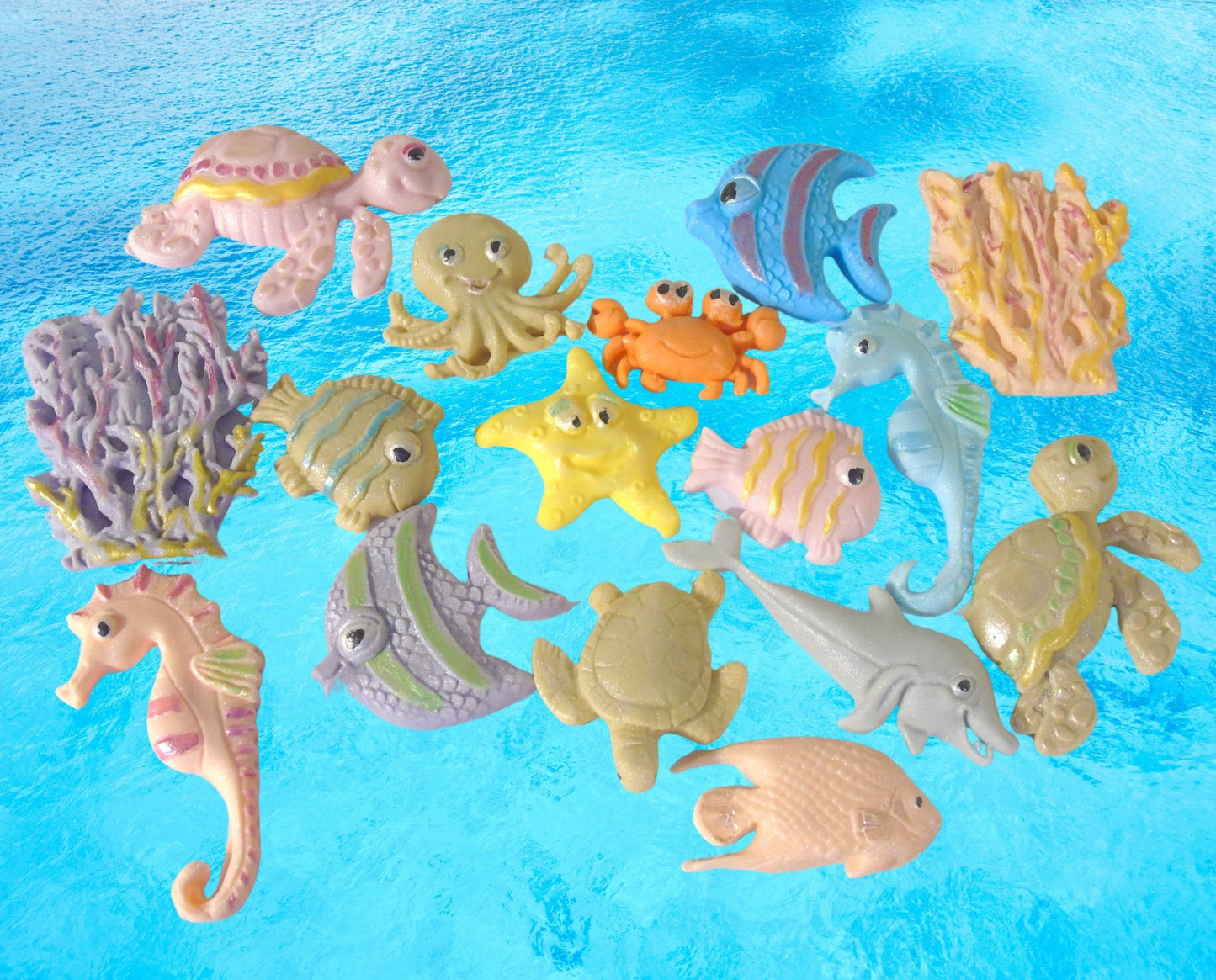 Collection of colorful edible sea creature figurines on a blue background