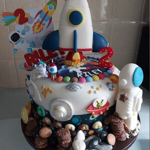 Customer image of their cake with some of our space cake topper added