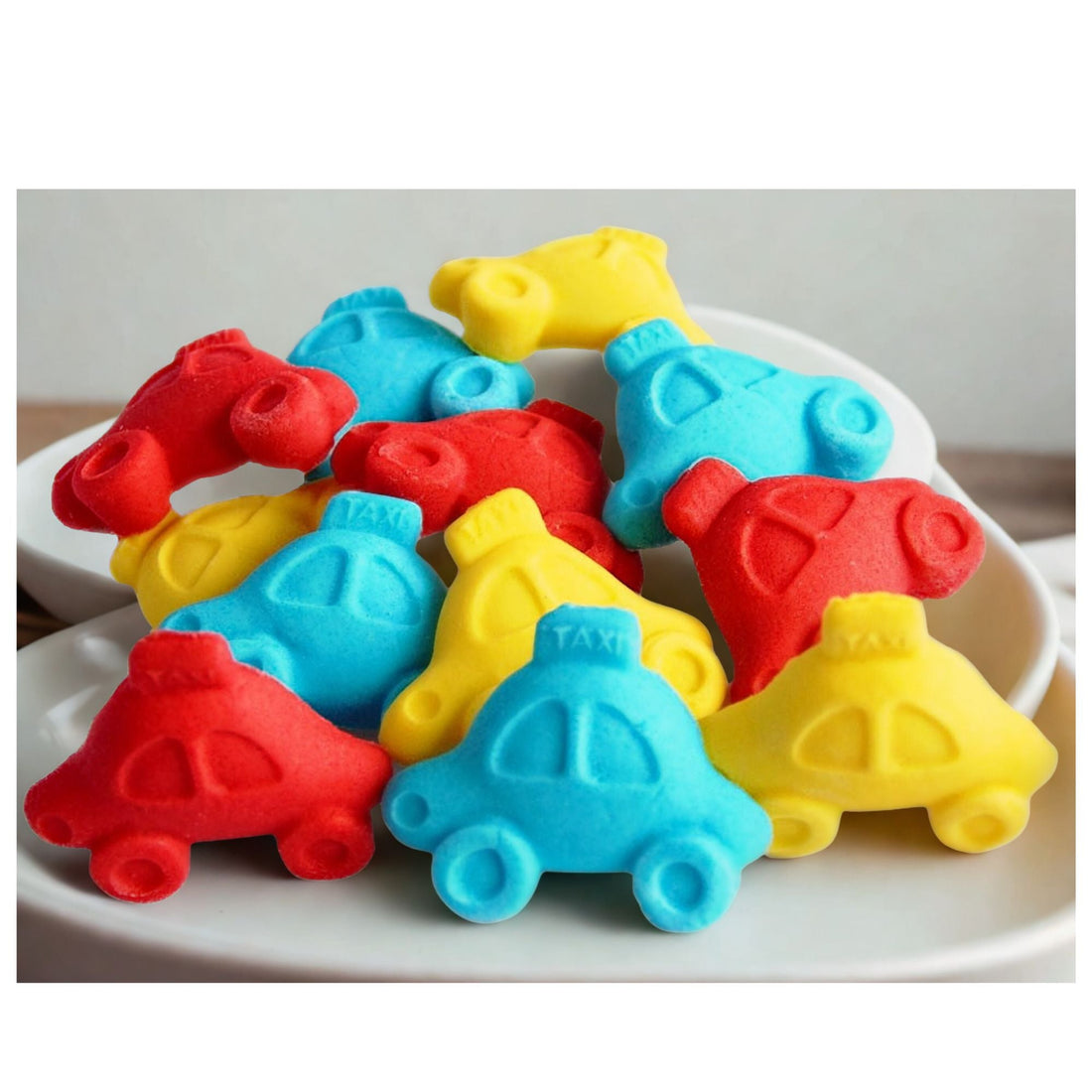 Assortment of coloured cars for cupcake and cake decorations