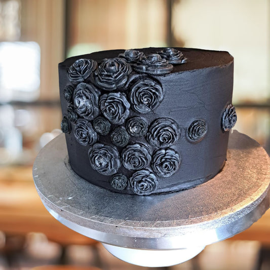 Customers Cake using our 3 different sizes of black roses