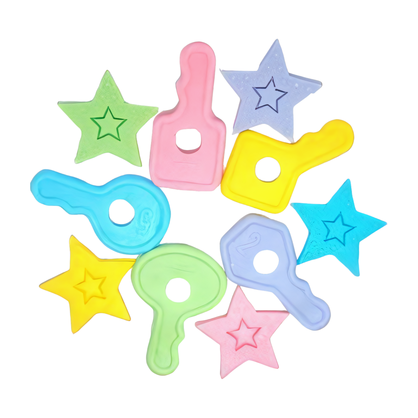 A circle of baby shower cake toppers. The toppers are in the shapes of keys and stars.