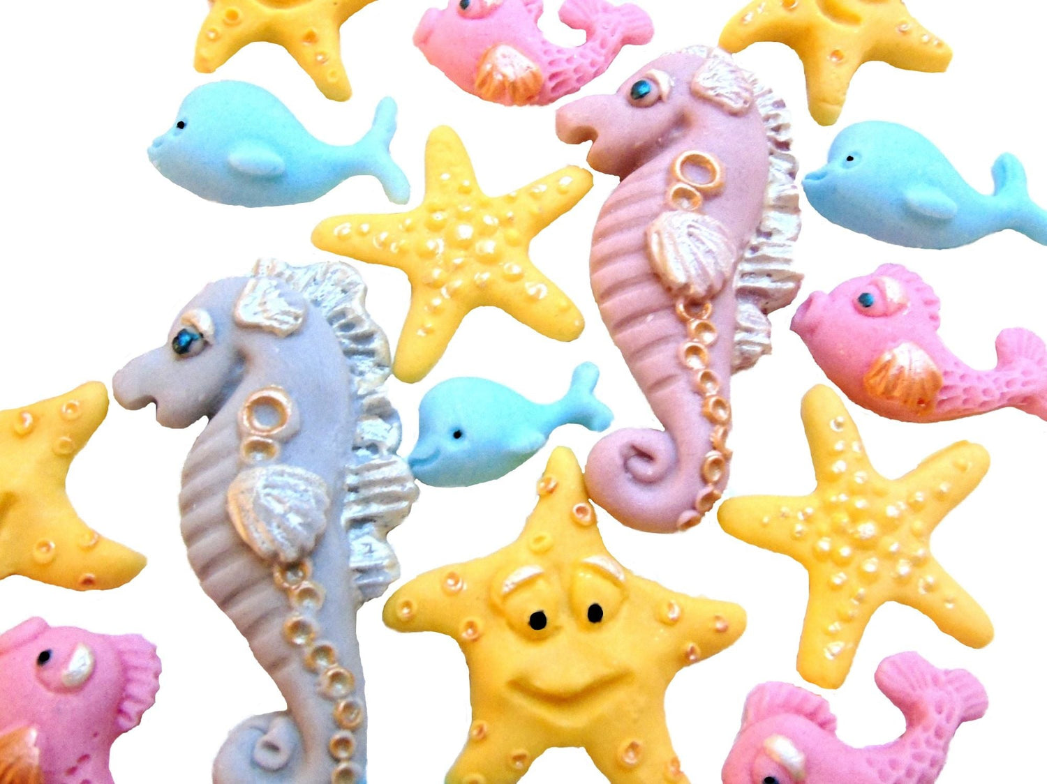 A collection of different sea animal cake toppers