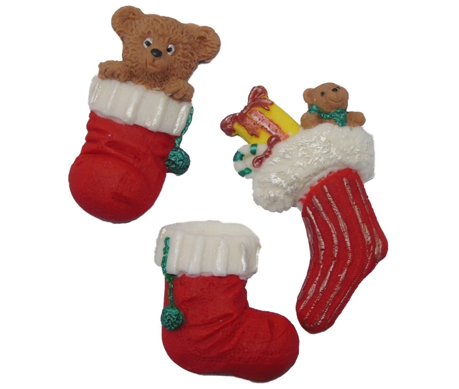 Three Christmas themed cake toppers. All three are stockings, one has a bear in it, another is empty and the last has assorted presents inside. 