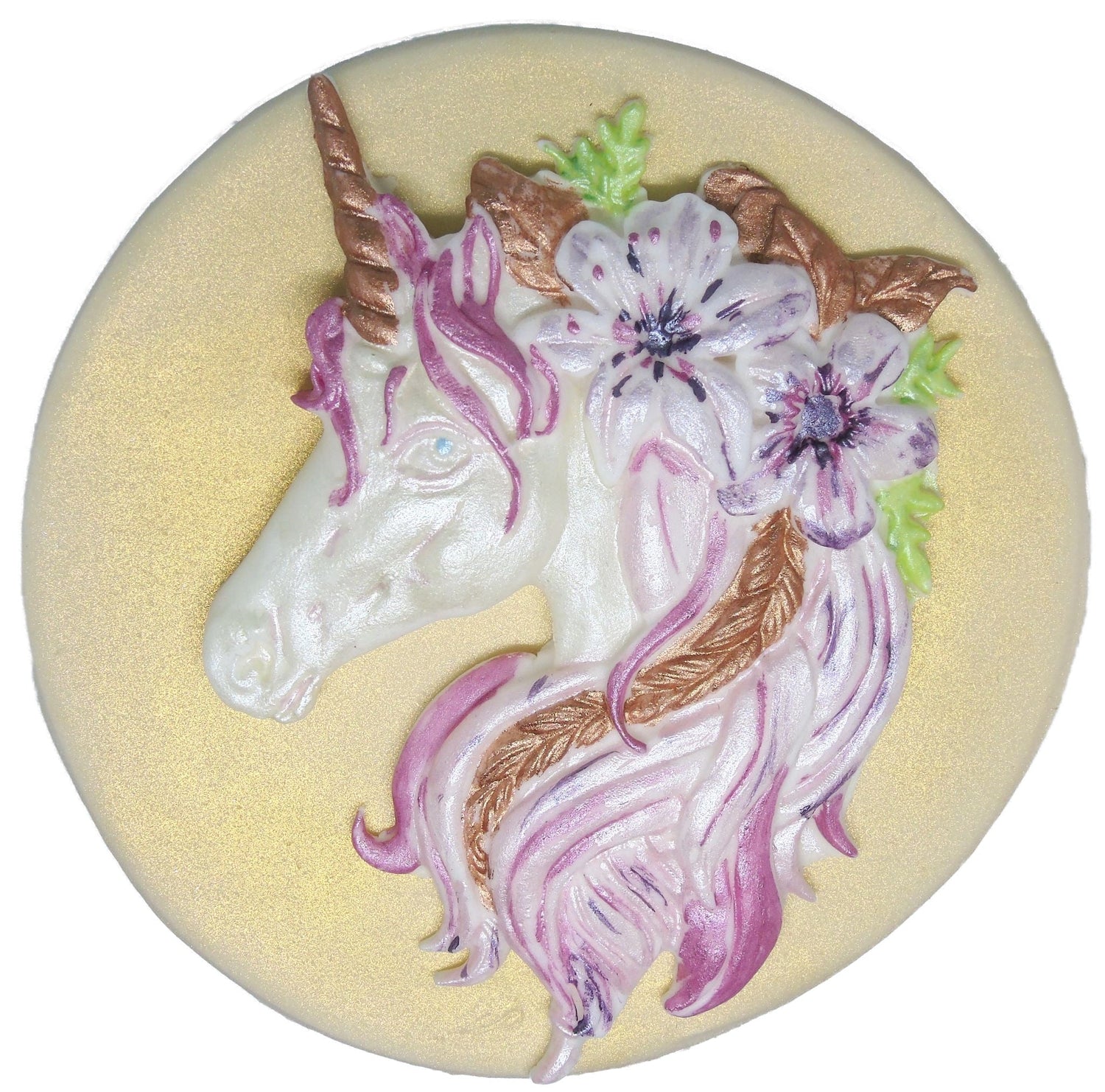 A unicorn cake topper with flowers and plants in its hair from the Unicorns & Gnomes collection.