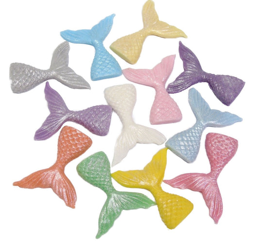 Assortment of glittered coloured mermaid tails edible cupcake toppers and great on cakes.