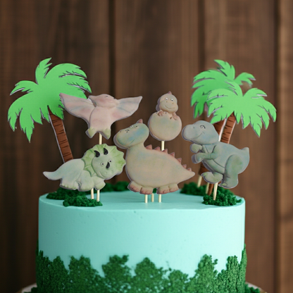 Cake with dinosaur toppers and palm trees on a brown background