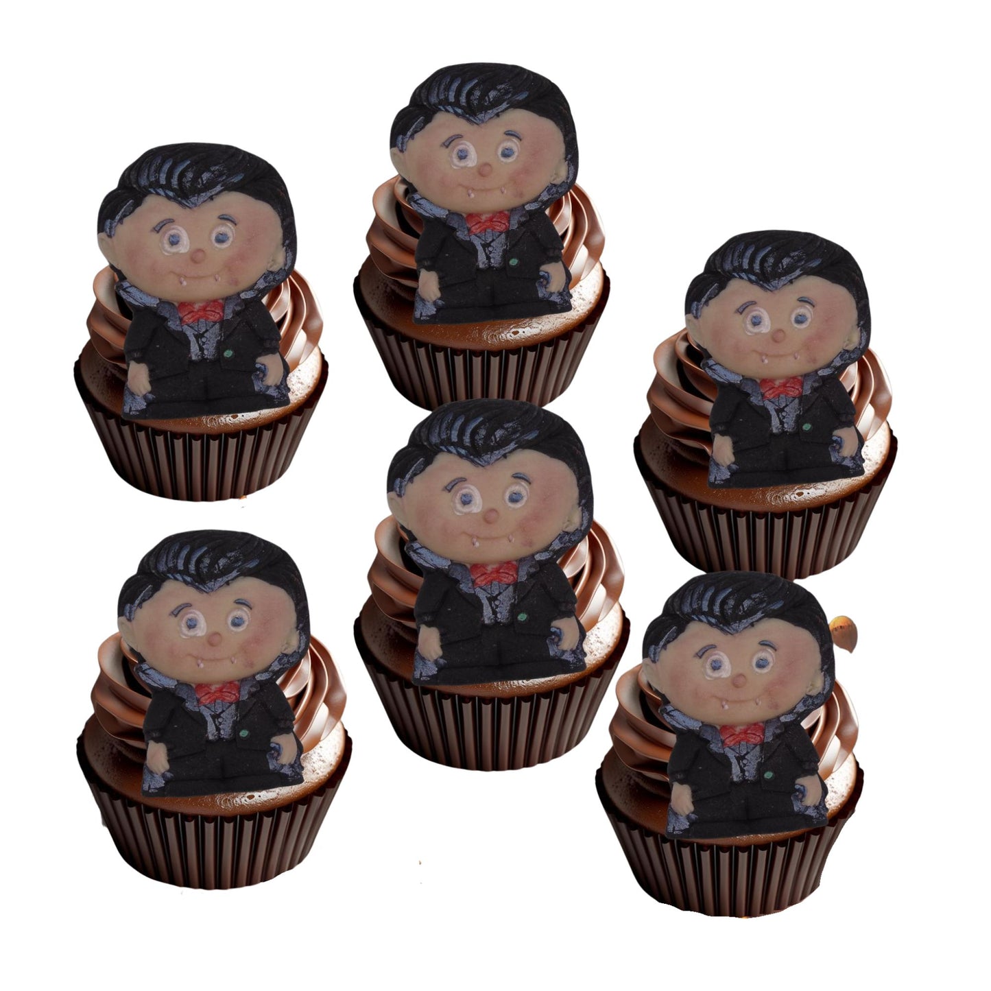 Cupcakes with Dracula character toppers placed on to with a white background
