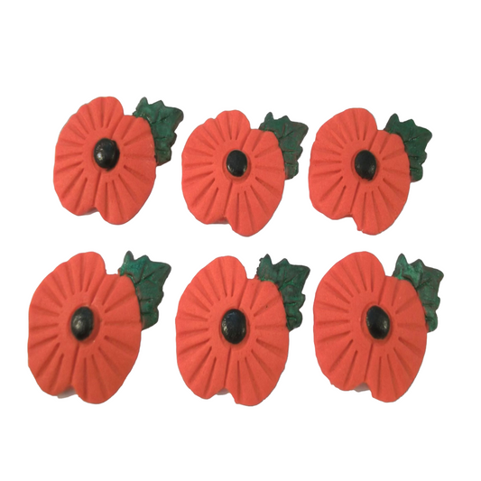 Six red poppy flowers with green leaves on a white background