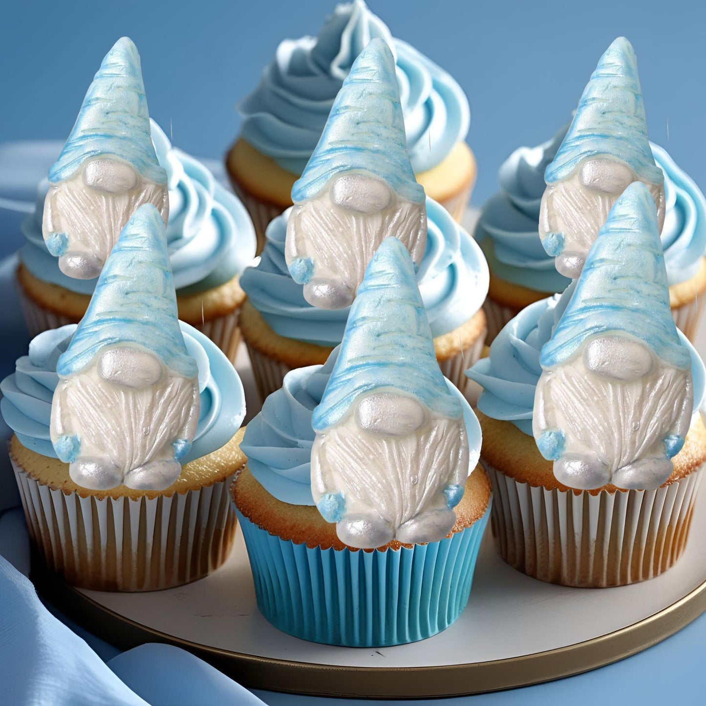 Cupcakes with blue gnome decorations on a blue background