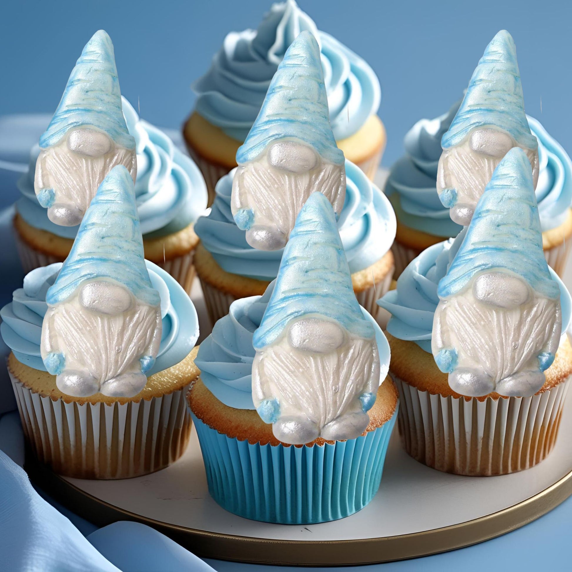 Cupcakes with blue gnome decorations on a blue background
