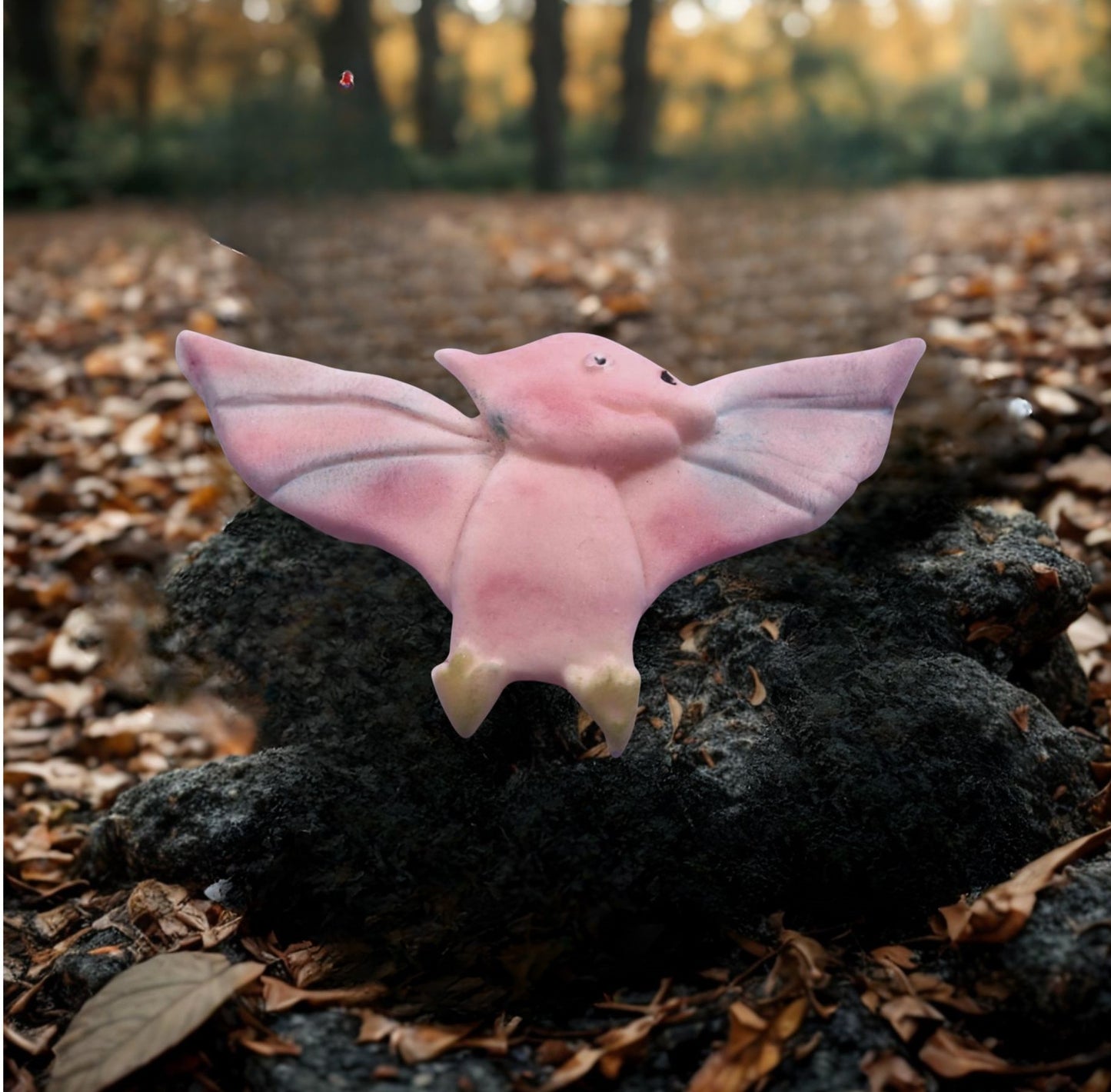 Single flying dinosaur cake topper decorations images shows it on a rock in natural set